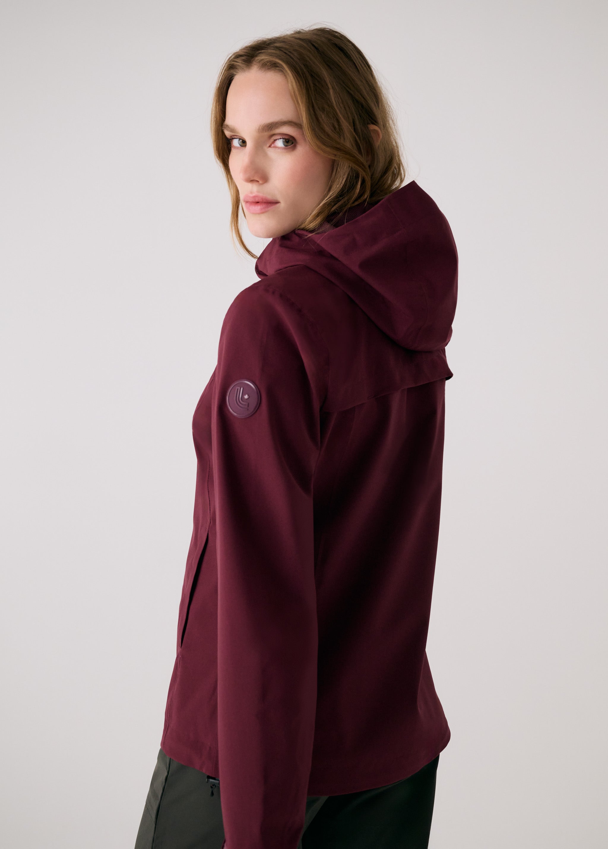 Lolë Element 2 Rain Jacket in burgundy — the Element 2 Rain Jacket is fully seam-sealed to keep moisture out