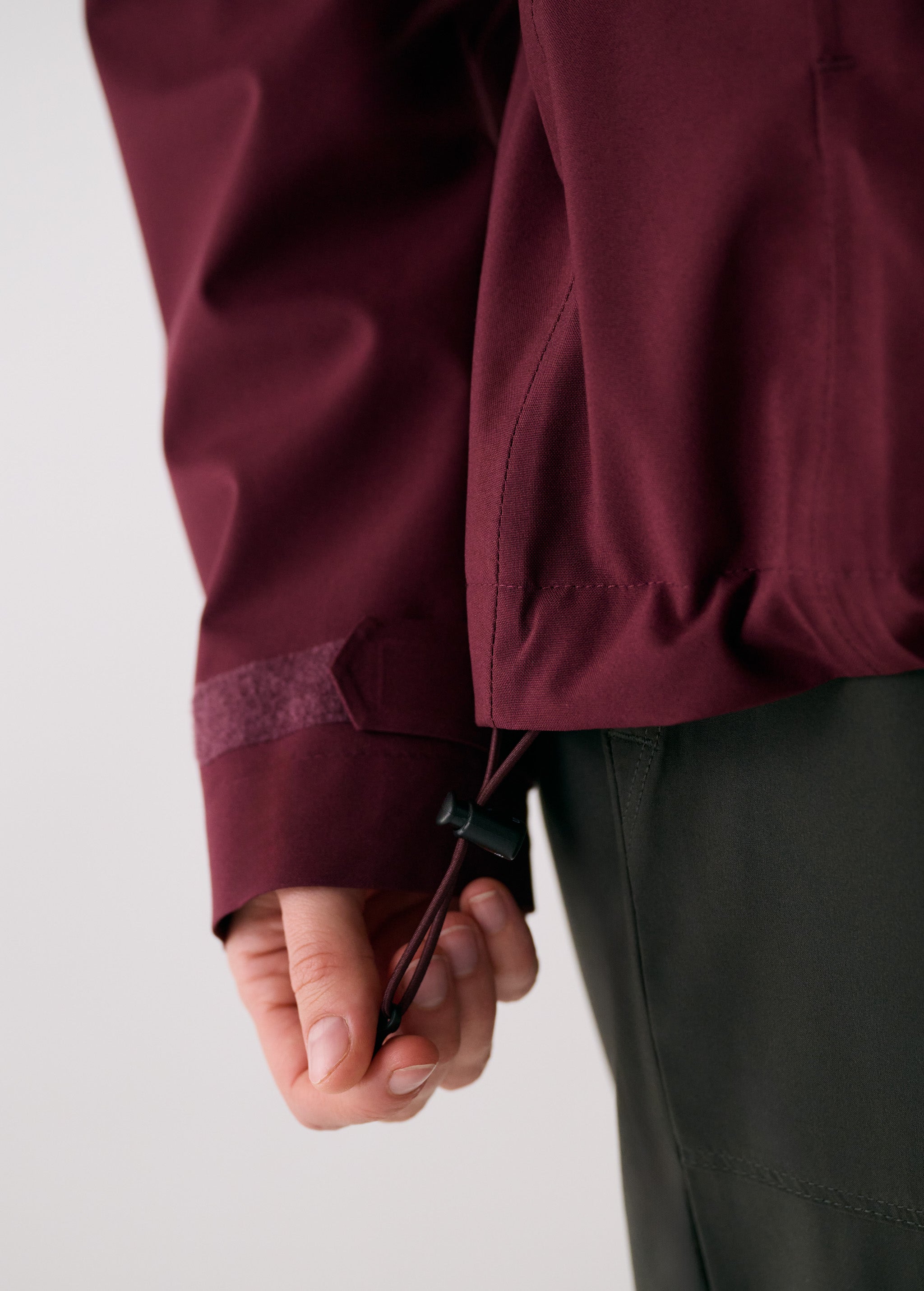 Lolë Element 2 Rain Jacket in burgundy — the Element 2 Rain Jacket is fully seam-sealed to keep moisture out