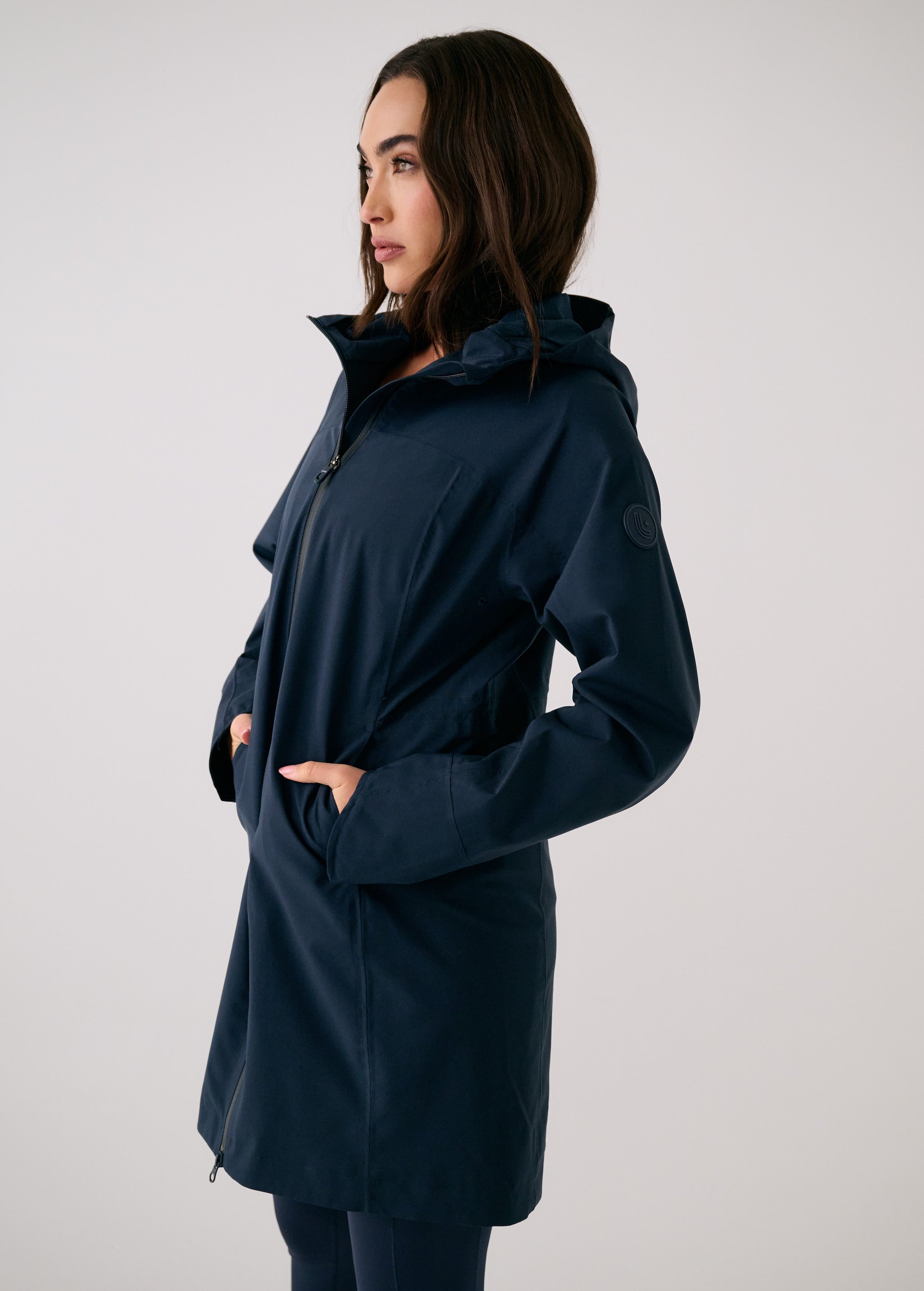 Lolë Element Long Rain Jacket in Outerspace navy — this longline jacket keeps water out while keeping your look sharp