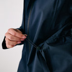 Lolë Element Long Rain Jacket in Outerspace navy — this longline jacket keeps water out while keeping your look sharp