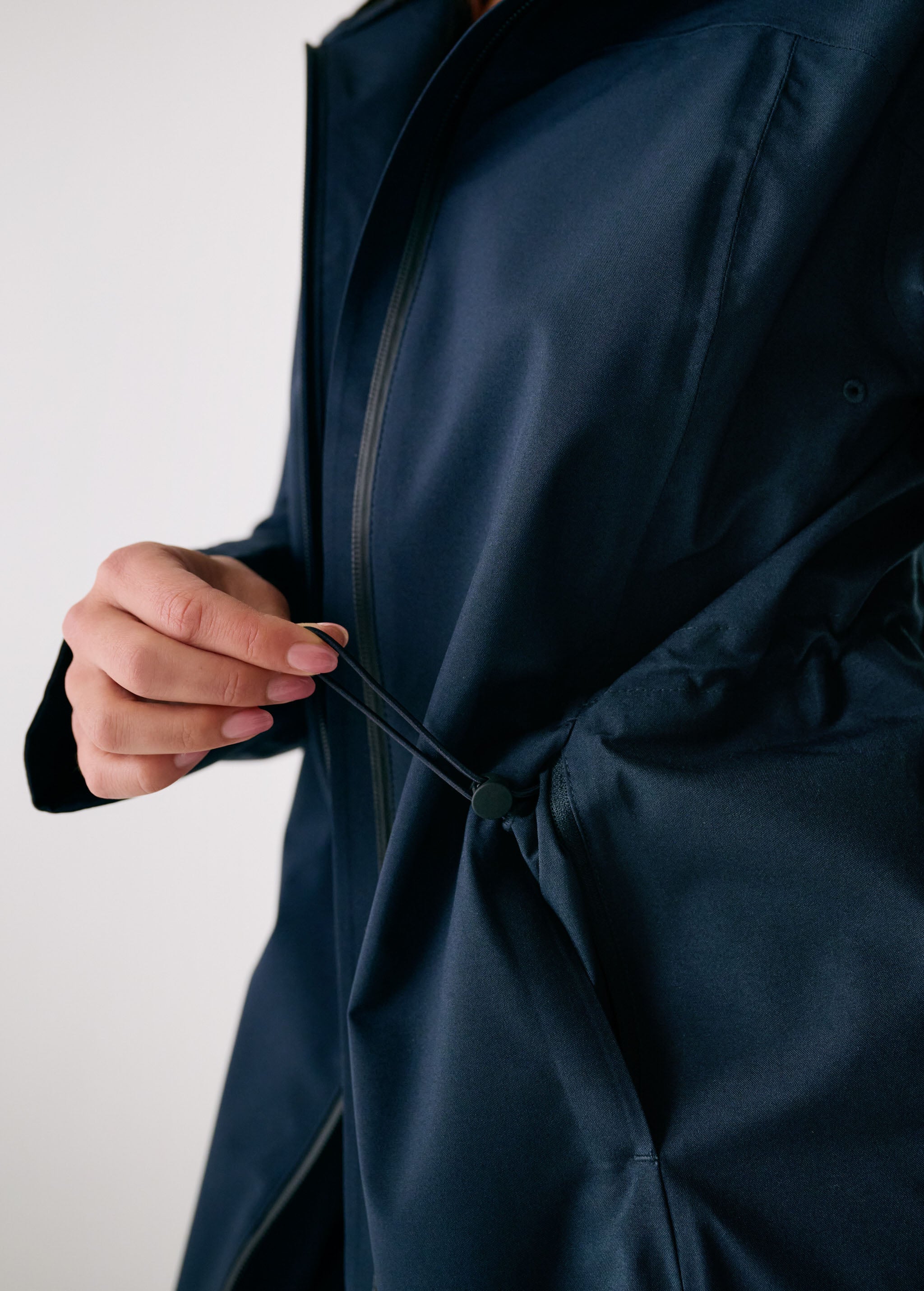 Lolë Element Long Rain Jacket in Outerspace navy — this longline jacket keeps water out while keeping your look sharp