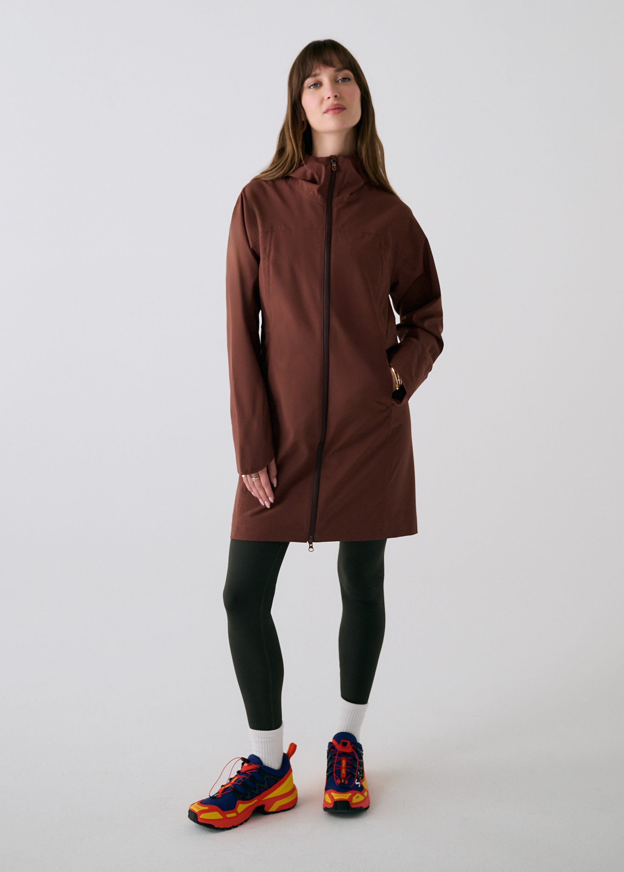 Lolë Element Long Rain Jacket in Sienna brown — this longline jacket keeps water out while keeping your look sharp