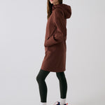 Lolë Element Long Rain Jacket in Sienna brown — this longline jacket keeps water out while keeping your look sharp