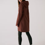 Lolë Element Long Rain Jacket in Sienna brown — this longline jacket keeps water out while keeping your look sharp