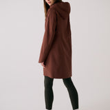 Lolë Element Long Rain Jacket in Sienna brown — this longline jacket keeps water out while keeping your look sharp