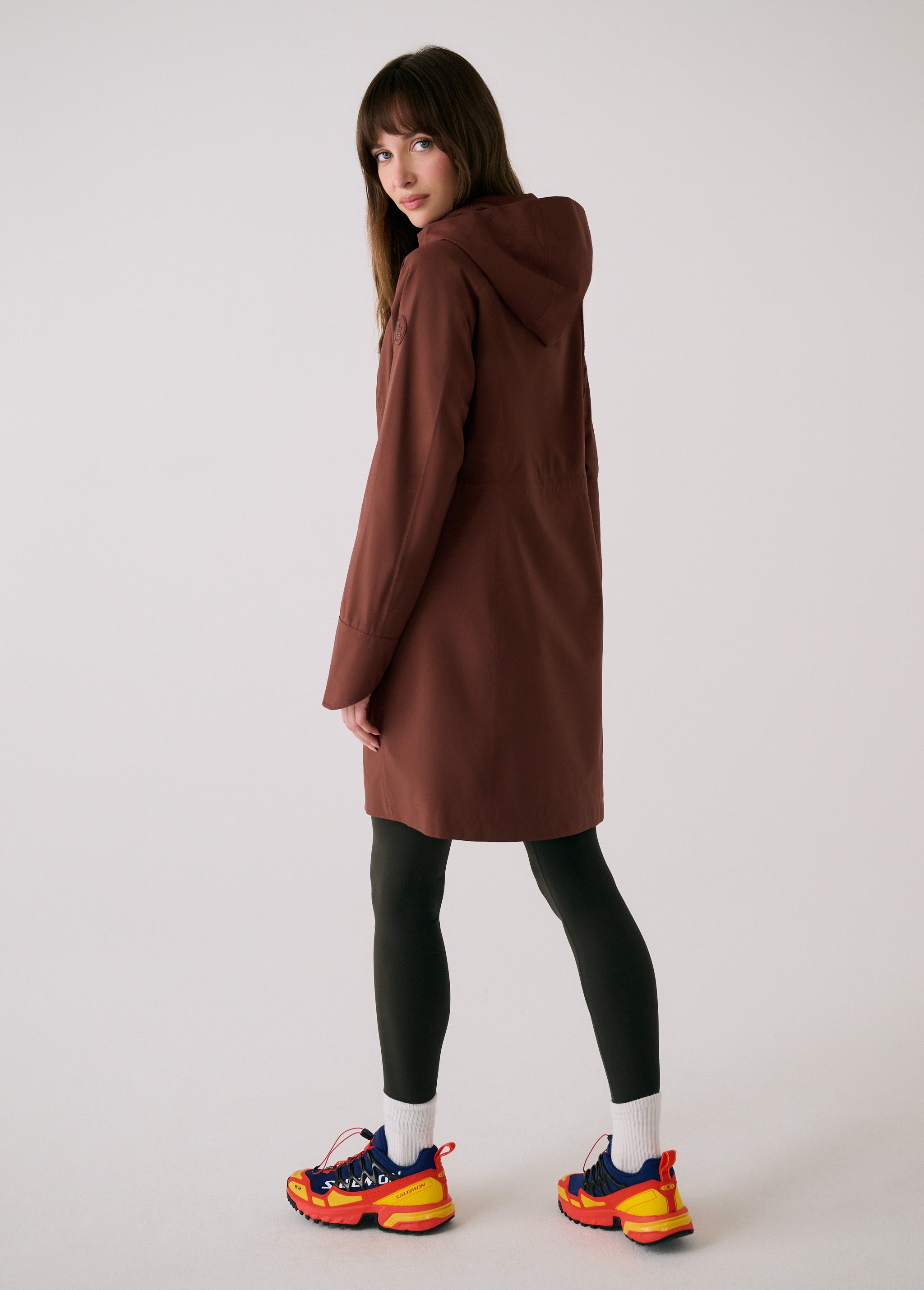Lolë Element Long Rain Jacket in Sienna brown — this longline jacket keeps water out while keeping your look sharp