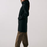 Lolë Element Long Rain Jacket in black — this longline jacket keeps water out while keeping your look sharp