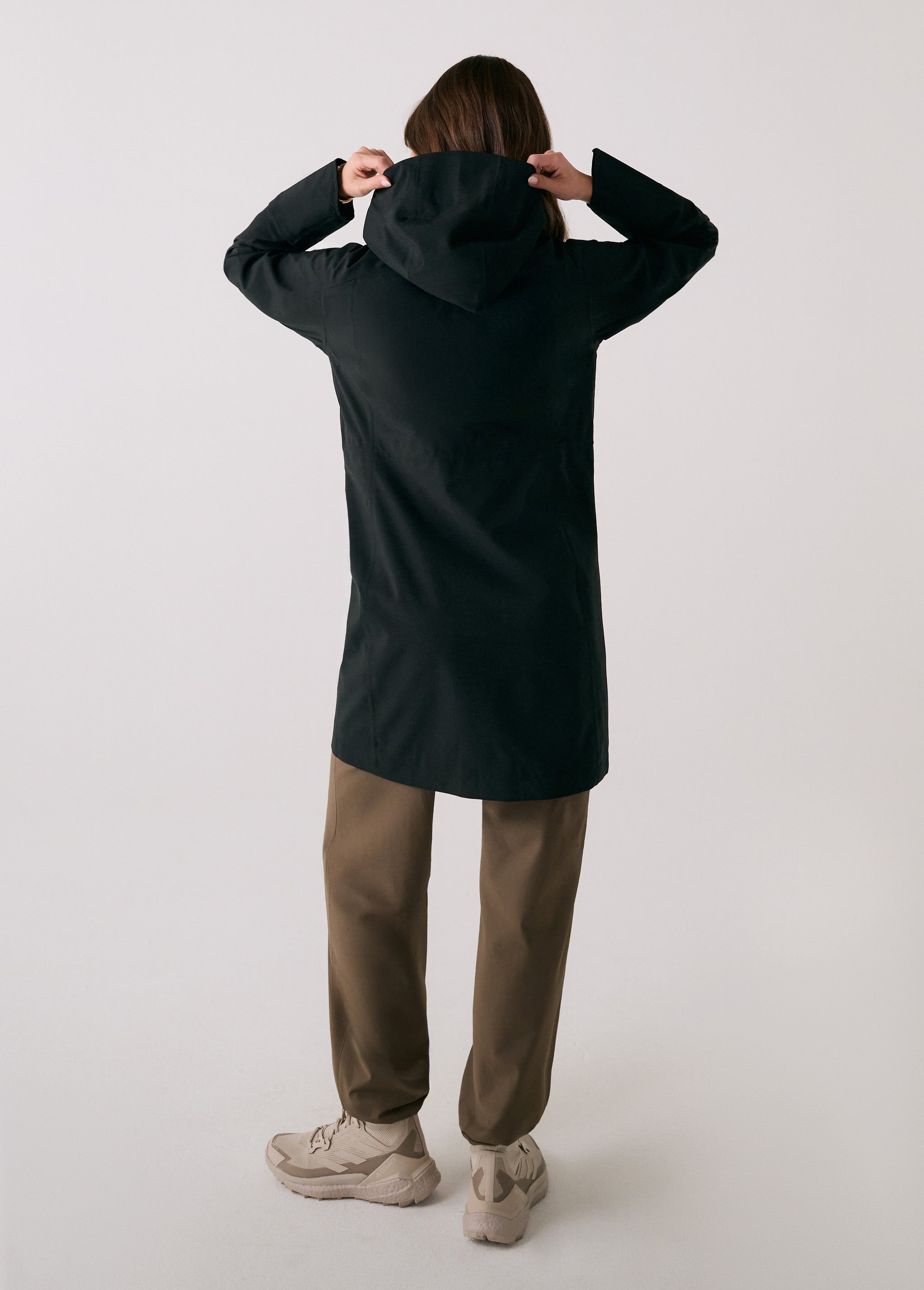 Lolë Element Long Rain Jacket in black — this longline jacket keeps water out while keeping your look sharp