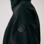 Lolë Element Long Rain Jacket in black — this longline jacket keeps water out while keeping your look sharp
