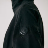 Lolë Element Long Rain Jacket in black — this longline jacket keeps water out while keeping your look sharp