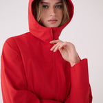 Lolë Element Long Rain Jacket in Poppy red — this longline jacket keeps water out while keeping your look sharp