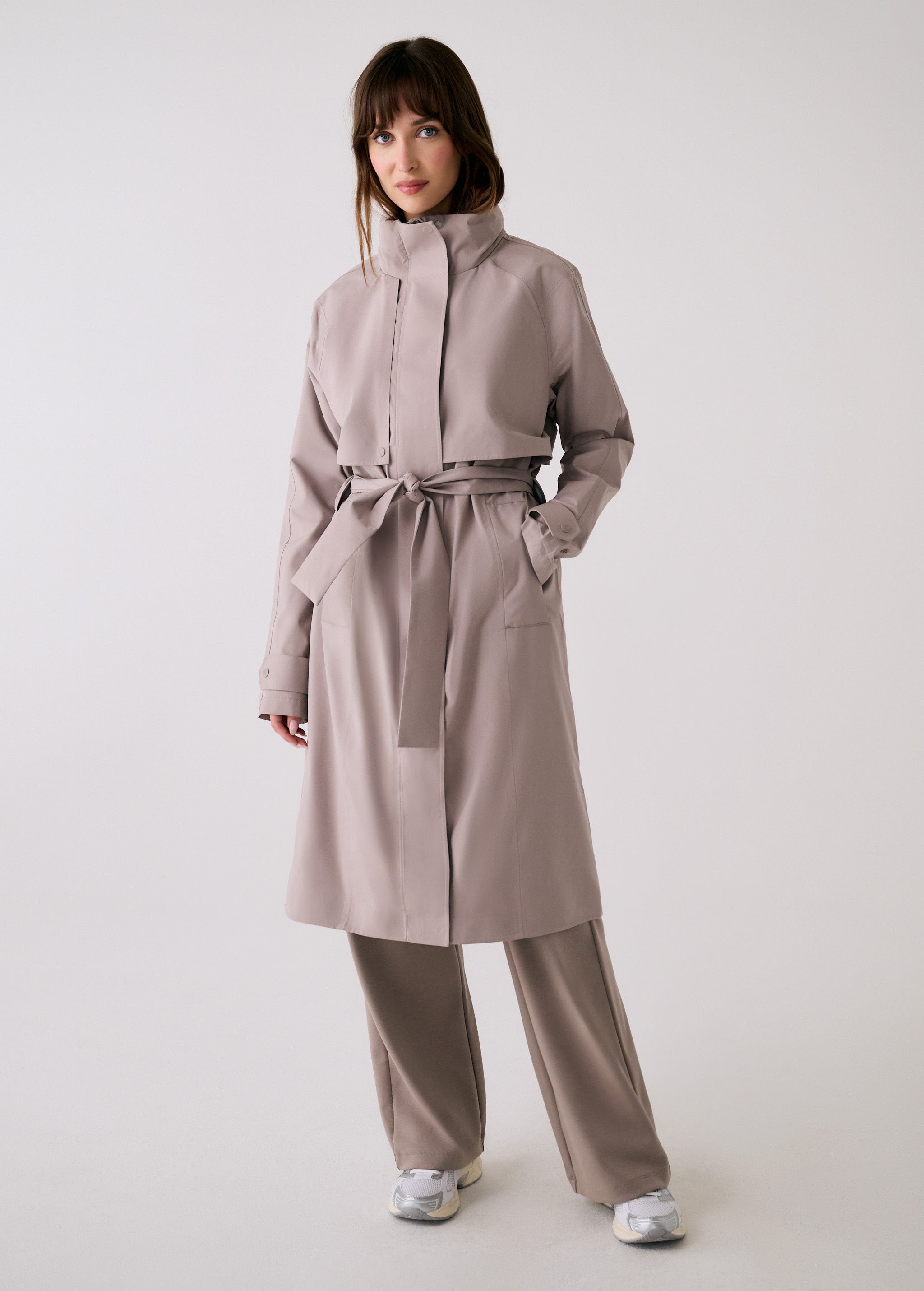 Lolë Alizé Trench Coat in Pebble taupe — fit note: Cut with a relaxed fit for comfortable layering