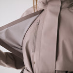 Lolë Alizé Trench Coat in Pebble taupe — fit note: Cut with a relaxed fit for comfortable layering