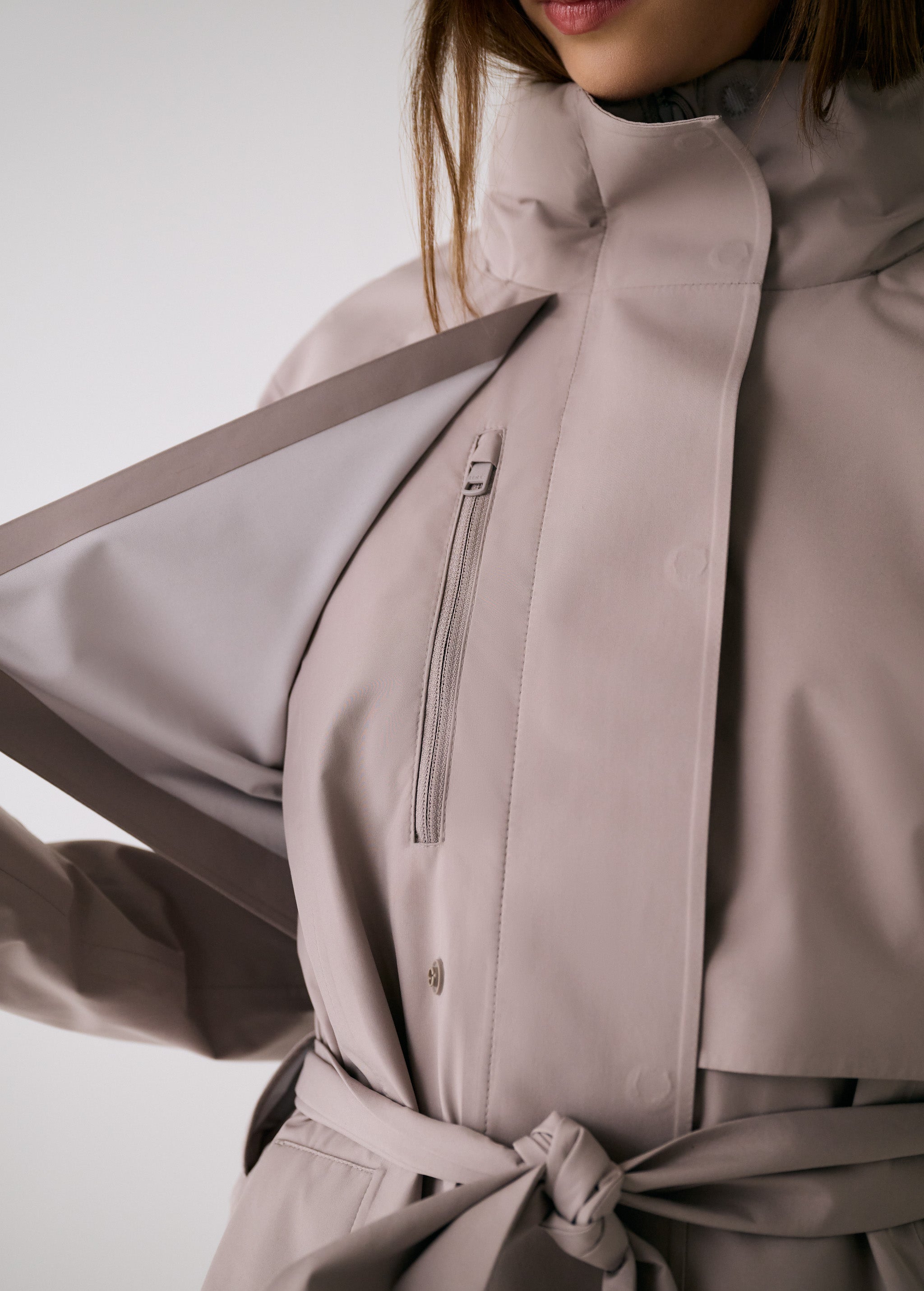 Lolë Alizé Trench Coat in Pebble taupe — fit note: Cut with a relaxed fit for comfortable layering