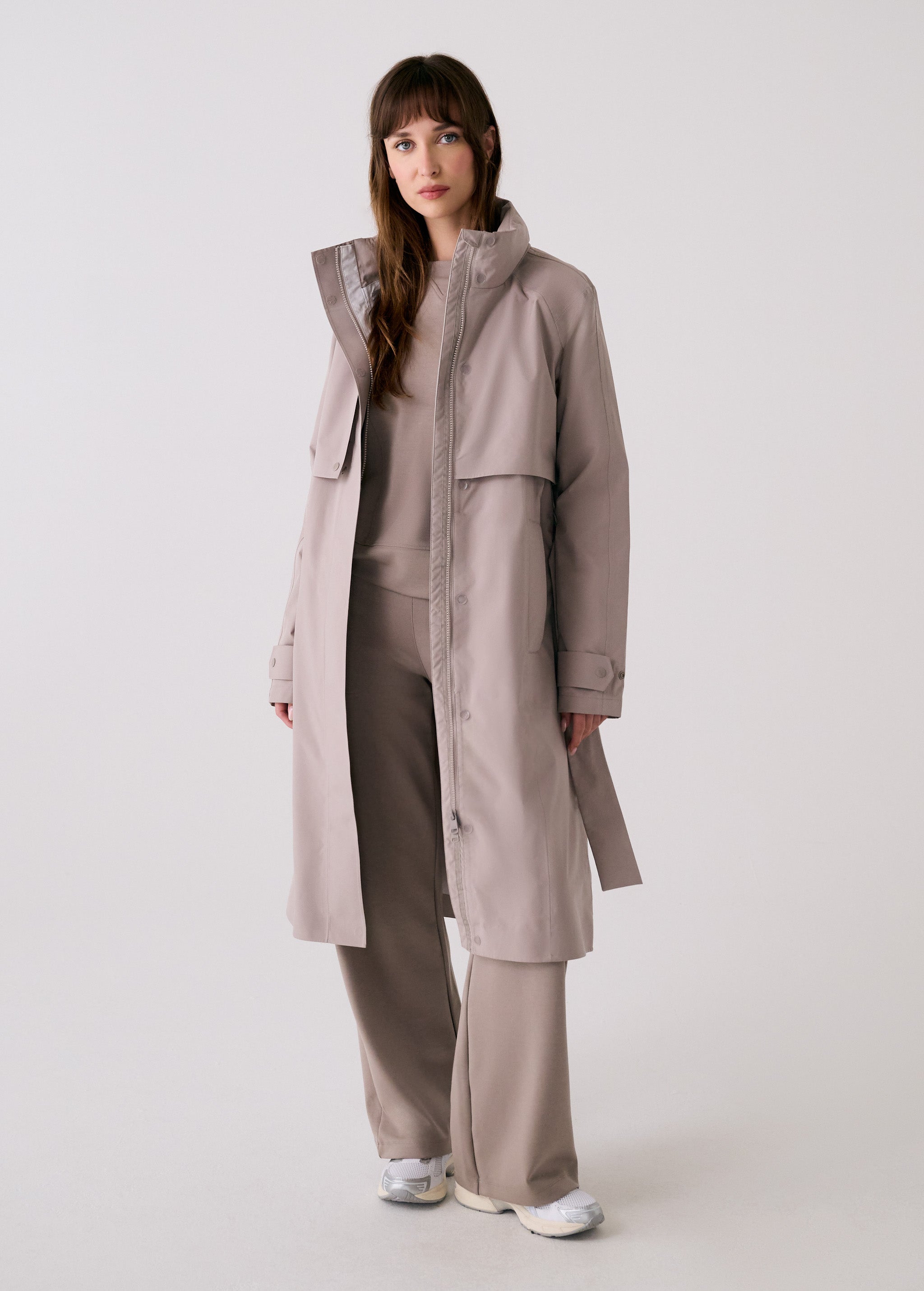 Lolë Alizé Trench Coat in Pebble taupe — fit note: Cut with a relaxed fit for comfortable layering