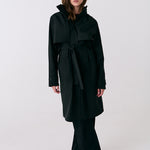 Lolë Alizé Trench Coat in black — fit note: Cut with a relaxed fit for comfortable layering
