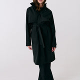 Lolë Alizé Trench Coat in black — fit note: Cut with a relaxed fit for comfortable layering