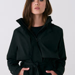 Lolë Alizé Trench Coat in black — fit note: Cut with a relaxed fit for comfortable layering