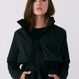 Lolë Alizé Trench Coat in black — fit note: Cut with a relaxed fit for comfortable layering