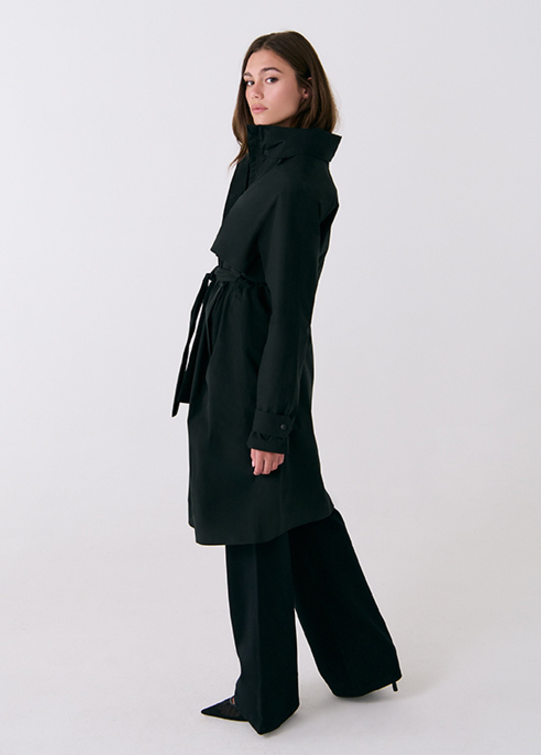 Lolë Alizé Trench Coat in black — fit note: Cut with a relaxed fit for comfortable layering
