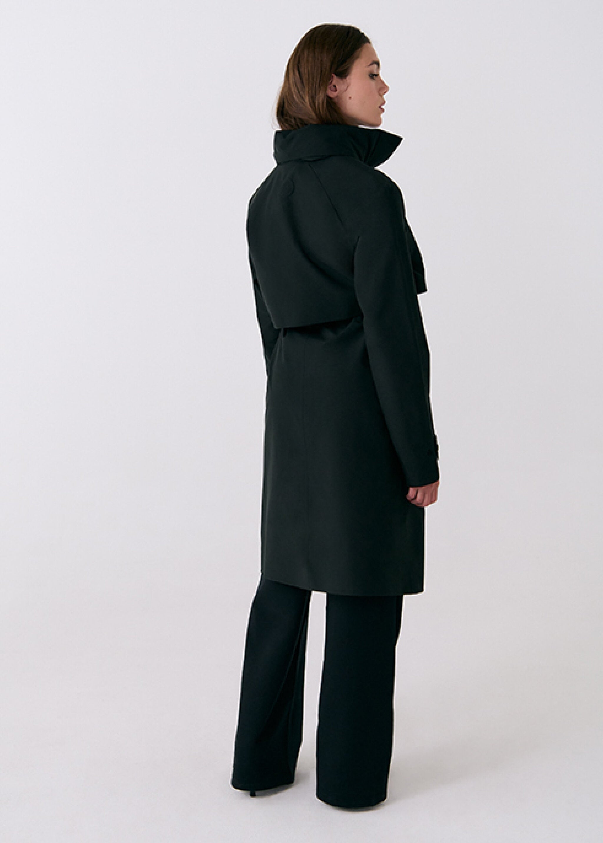 Lolë Alizé Trench Coat in black — fit note: Cut with a relaxed fit for comfortable layering