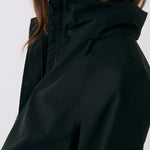 Lolë Alizé Trench Coat in black — fit note: Cut with a relaxed fit for comfortable layering