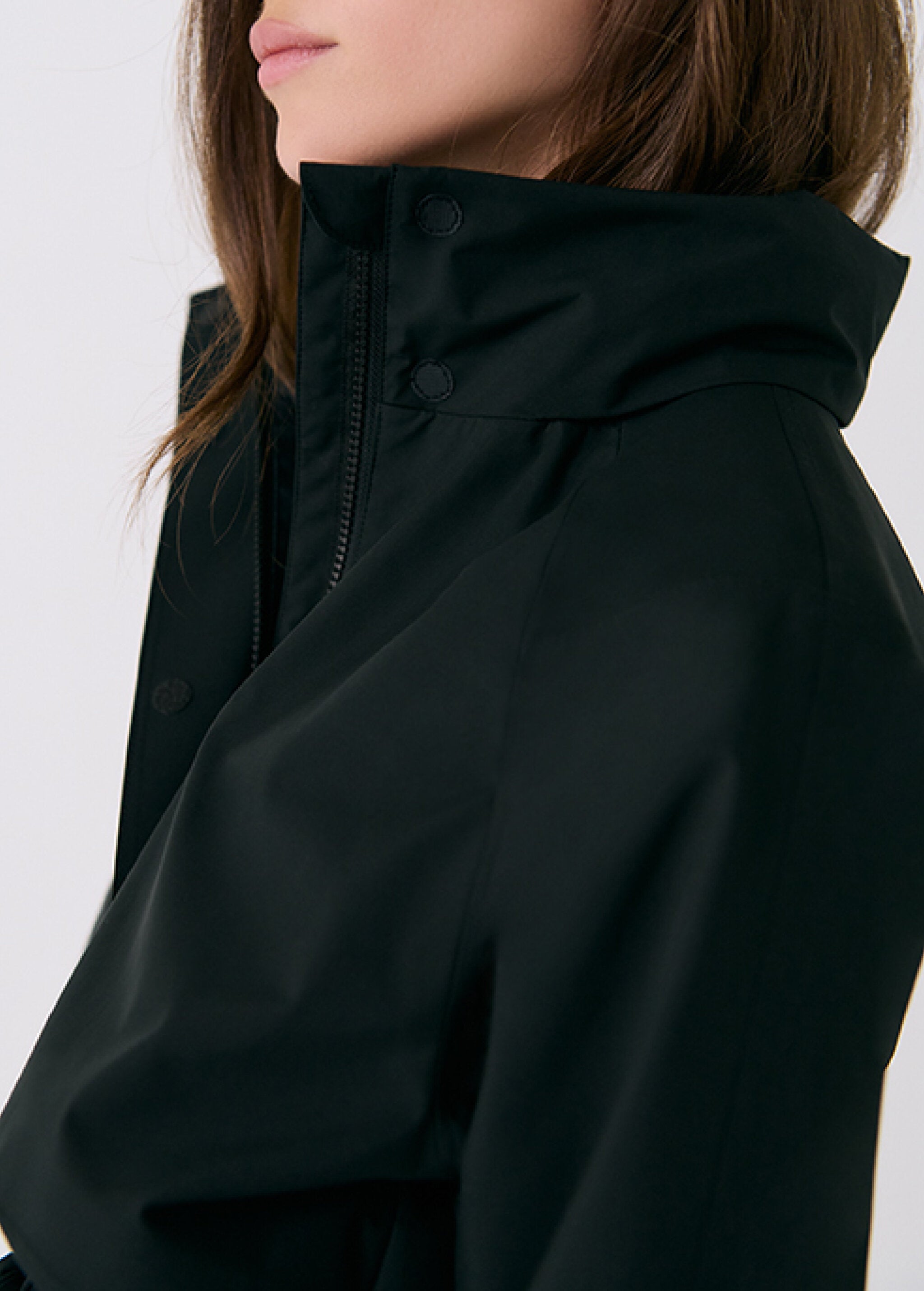 Lolë Alizé Trench Coat in black — fit note: Cut with a relaxed fit for comfortable layering