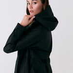 Lolë Alizé Trench Coat in black — fit note: Cut with a relaxed fit for comfortable layering