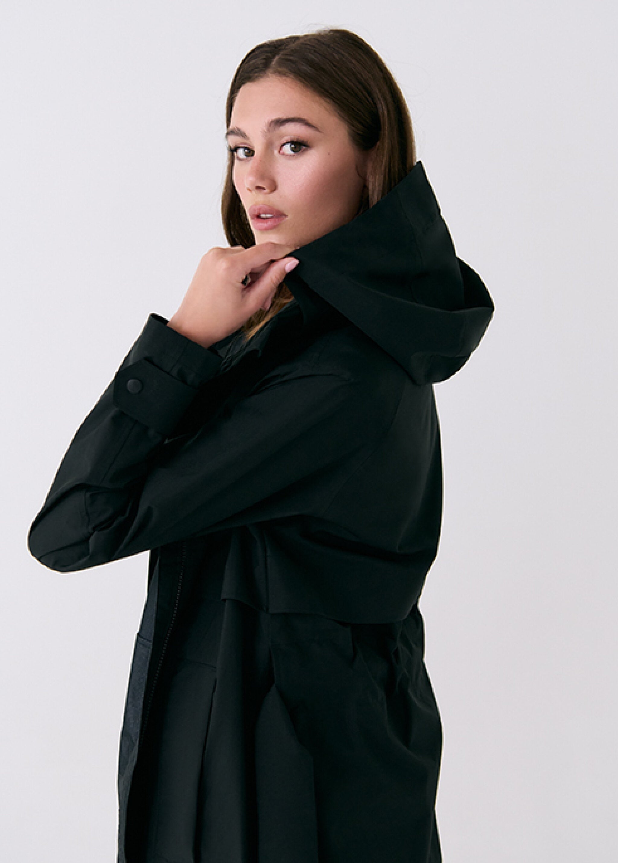 Lolë Alizé Trench Coat in black — fit note: Cut with a relaxed fit for comfortable layering