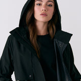 Lolë Alizé Trench Coat in black — fit note: Cut with a relaxed fit for comfortable layering