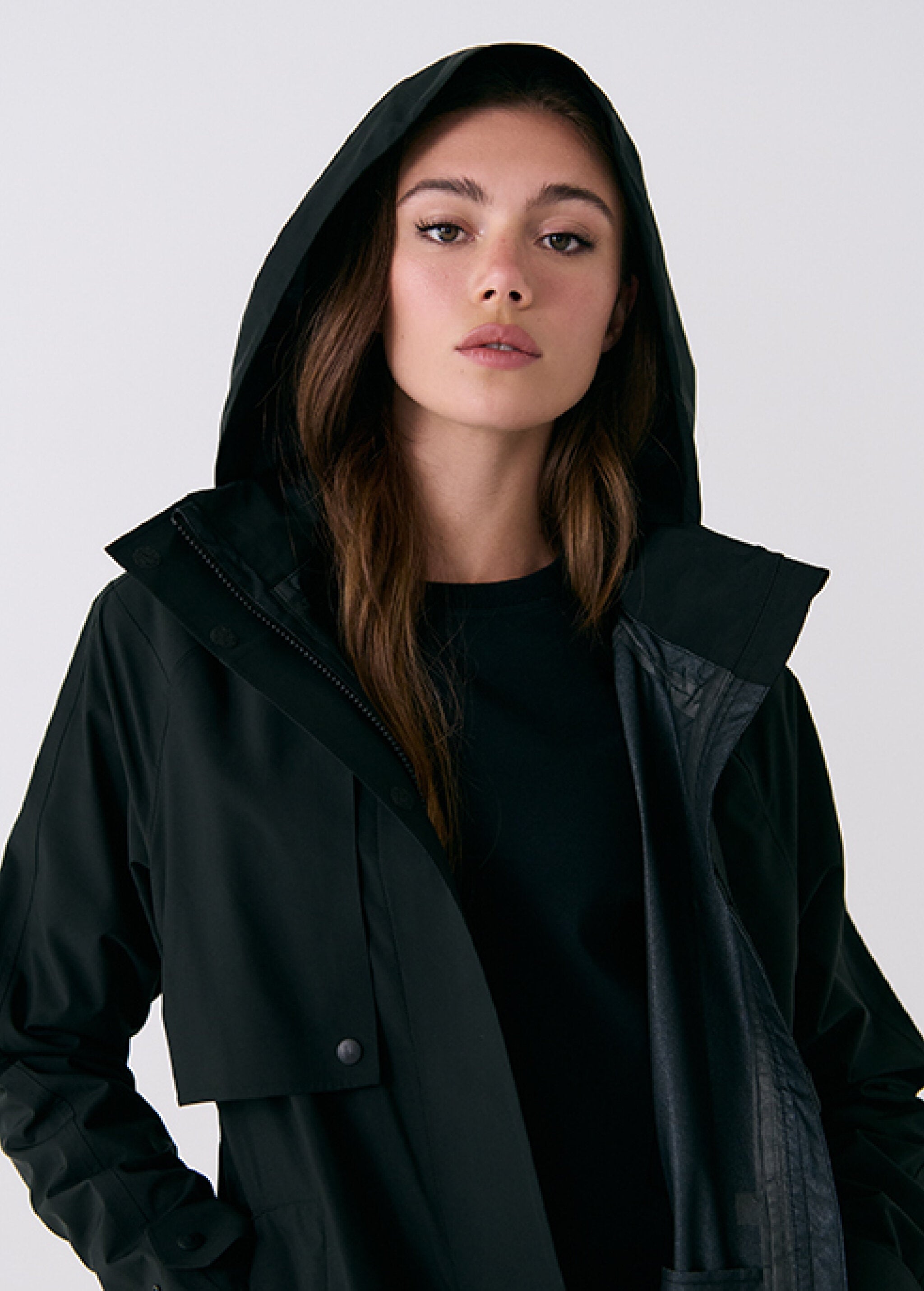Lolë Alizé Trench Coat in black — fit note: Cut with a relaxed fit for comfortable layering