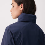 Lolë Alizé Short Trench Coat in Outerspace navy — fit note: Cut with a relaxed fit for comfortable layering