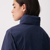 Lolë Alizé Short Trench Coat in Outerspace navy — fit note: Cut with a relaxed fit for comfortable layering
