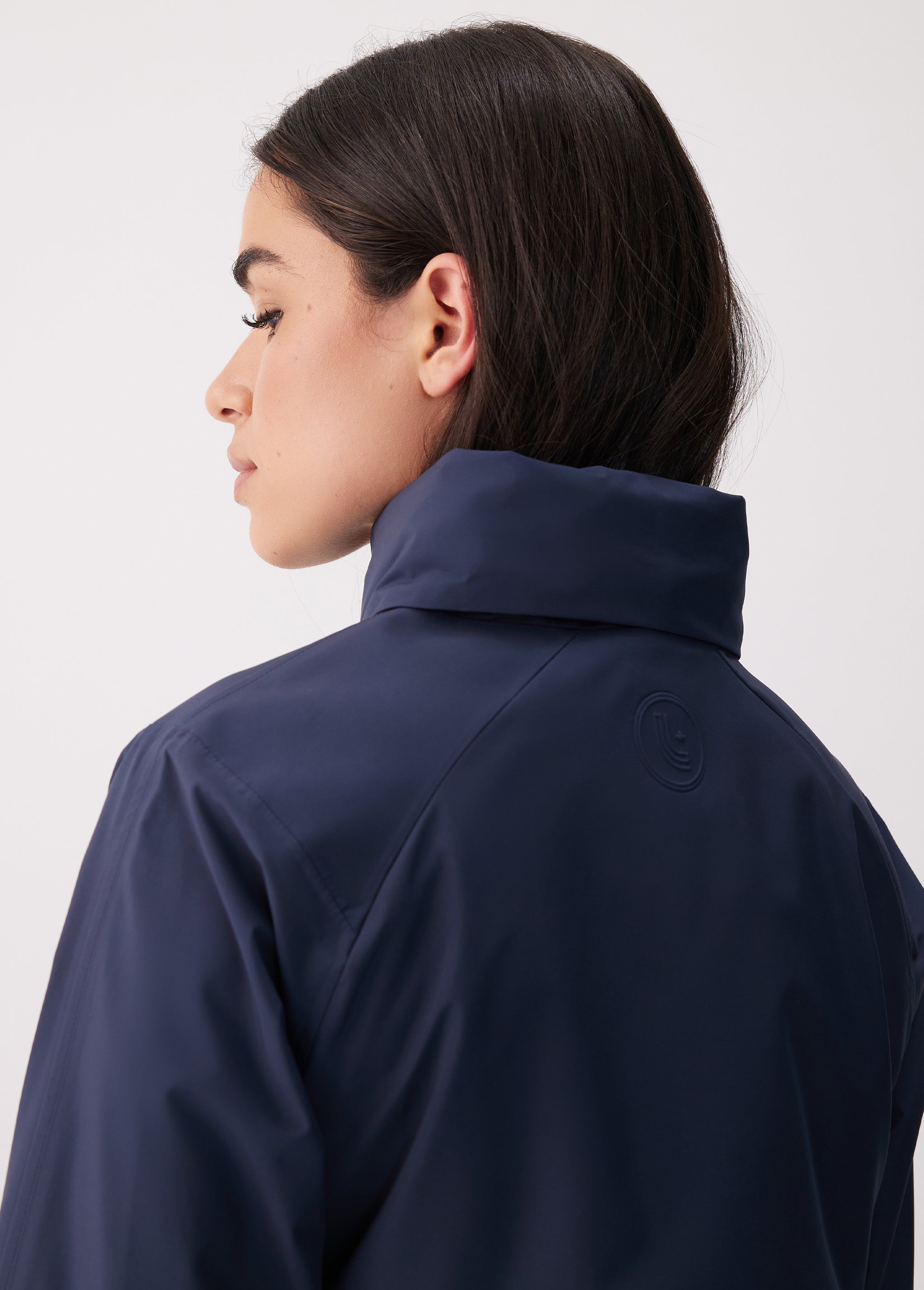 Lolë Alizé Short Trench Coat in Outerspace navy — fit note: Cut with a relaxed fit for comfortable layering
