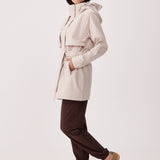 Lolë Alizé Short Trench Coat in Abalone pale greige — fit note: Cut with a relaxed fit for comfortable layering