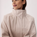 Lolë Alizé Short Trench Coat in Abalone pale greige — fit note: Cut with a relaxed fit for comfortable layering