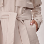 Lolë Alizé Short Trench Coat in Abalone pale greige — fit note: Cut with a relaxed fit for comfortable layering