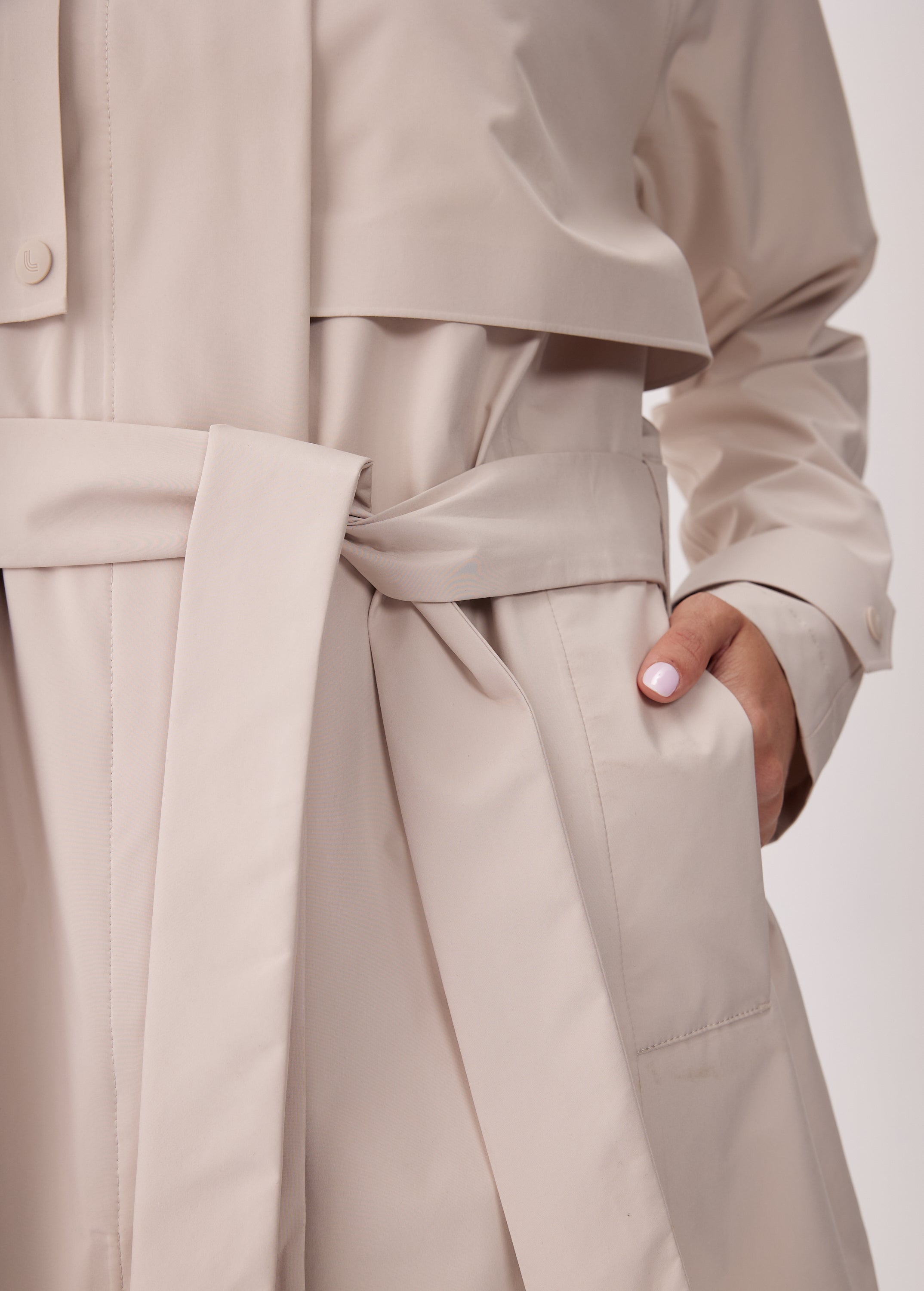 Lolë Alizé Short Trench Coat in Abalone pale greige — fit note: Cut with a relaxed fit for comfortable layering
