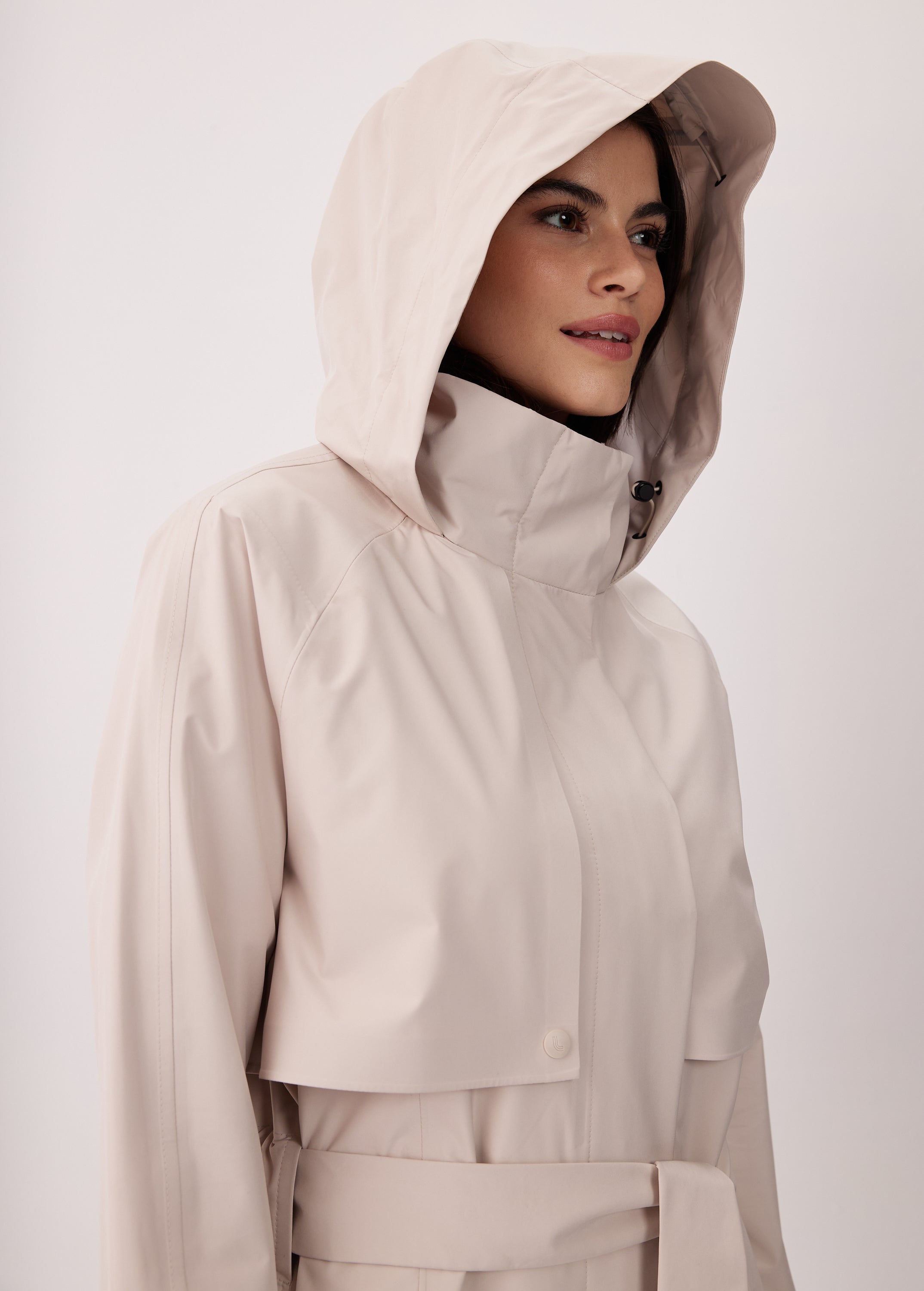 Lolë Alizé Short Trench Coat in Abalone pale greige — fit note: Cut with a relaxed fit for comfortable layering