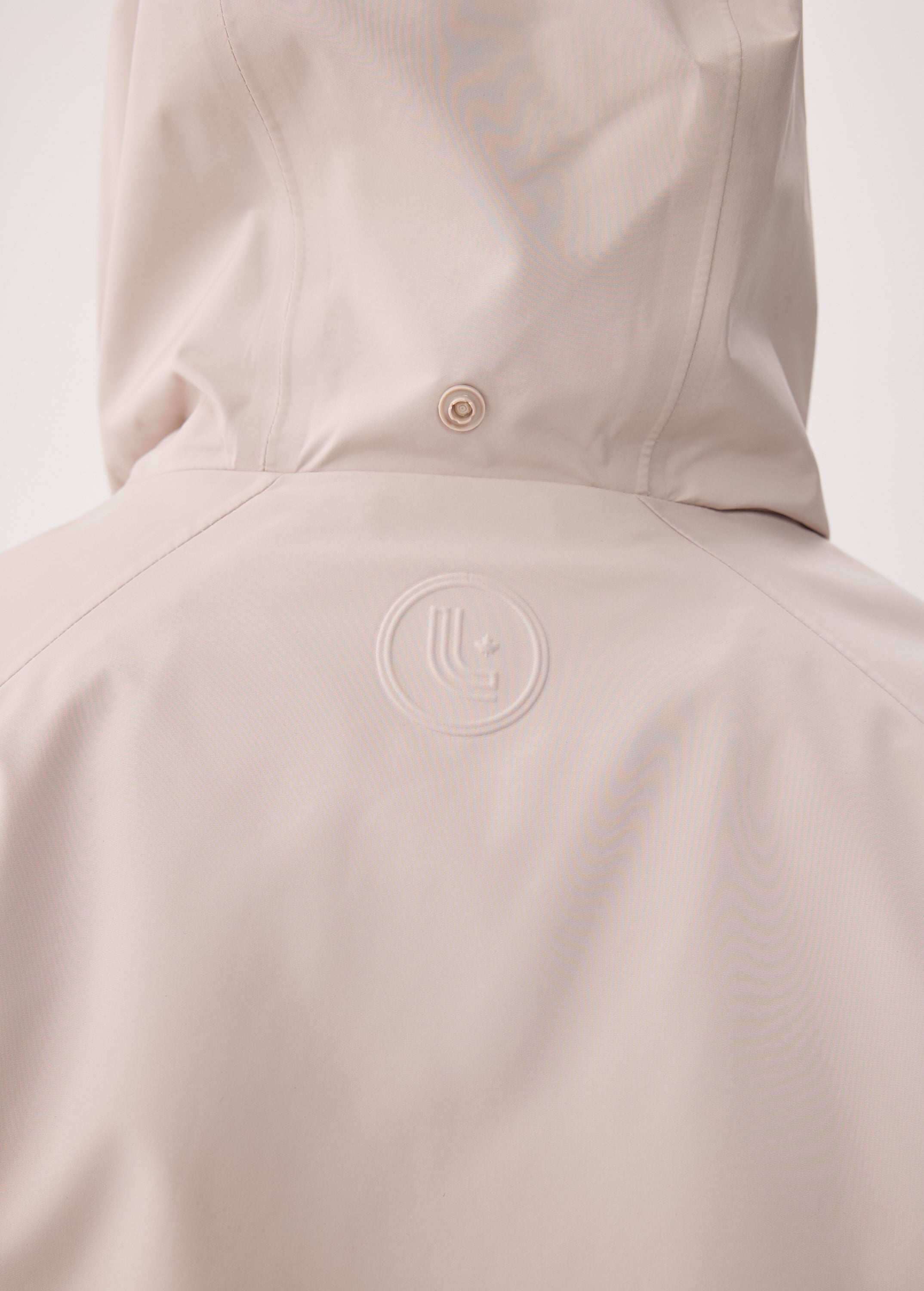 Lolë Alizé Short Trench Coat in Abalone pale greige — fit note: Cut with a relaxed fit for comfortable layering