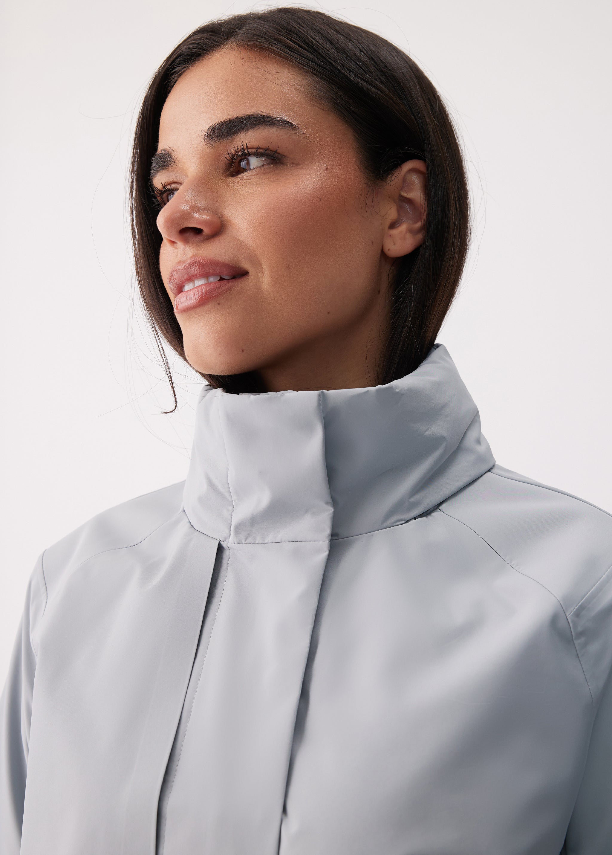 Lolë Alizé Short Trench Coat in Steel light grey — fit note: Cut with a relaxed fit for comfortable layering