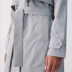 Lolë Alizé Short Trench Coat in Steel light grey — fit note: Cut with a relaxed fit for comfortable layering