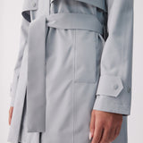 Lolë Alizé Short Trench Coat in Steel light grey — fit note: Cut with a relaxed fit for comfortable layering
