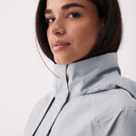 Lolë Alizé Short Trench Coat in Steel light grey — fit note: Cut with a relaxed fit for comfortable layering
