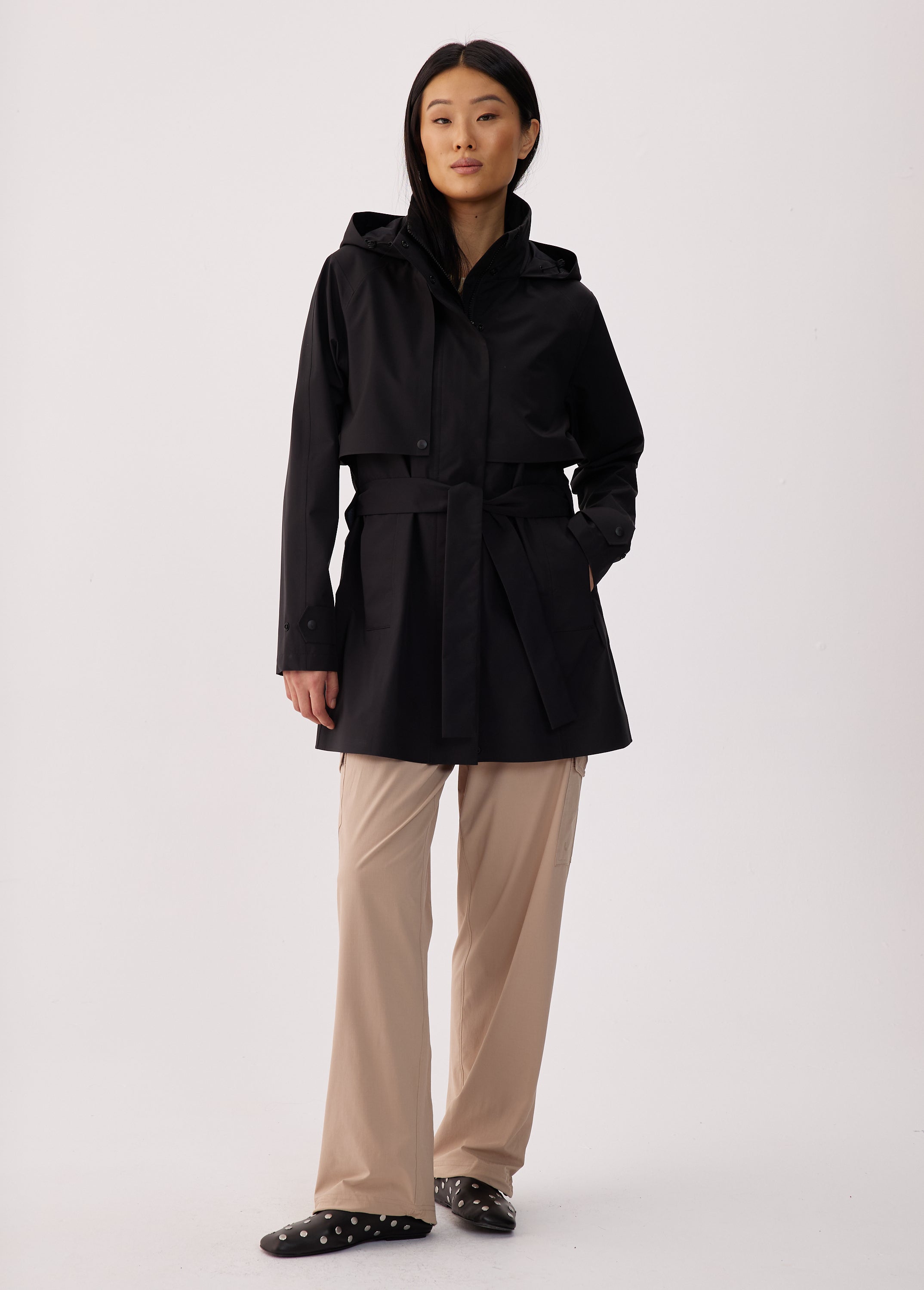 Lolë Alizé Short Trench Coat in black — fit note: Cut with a relaxed fit for comfortable layering