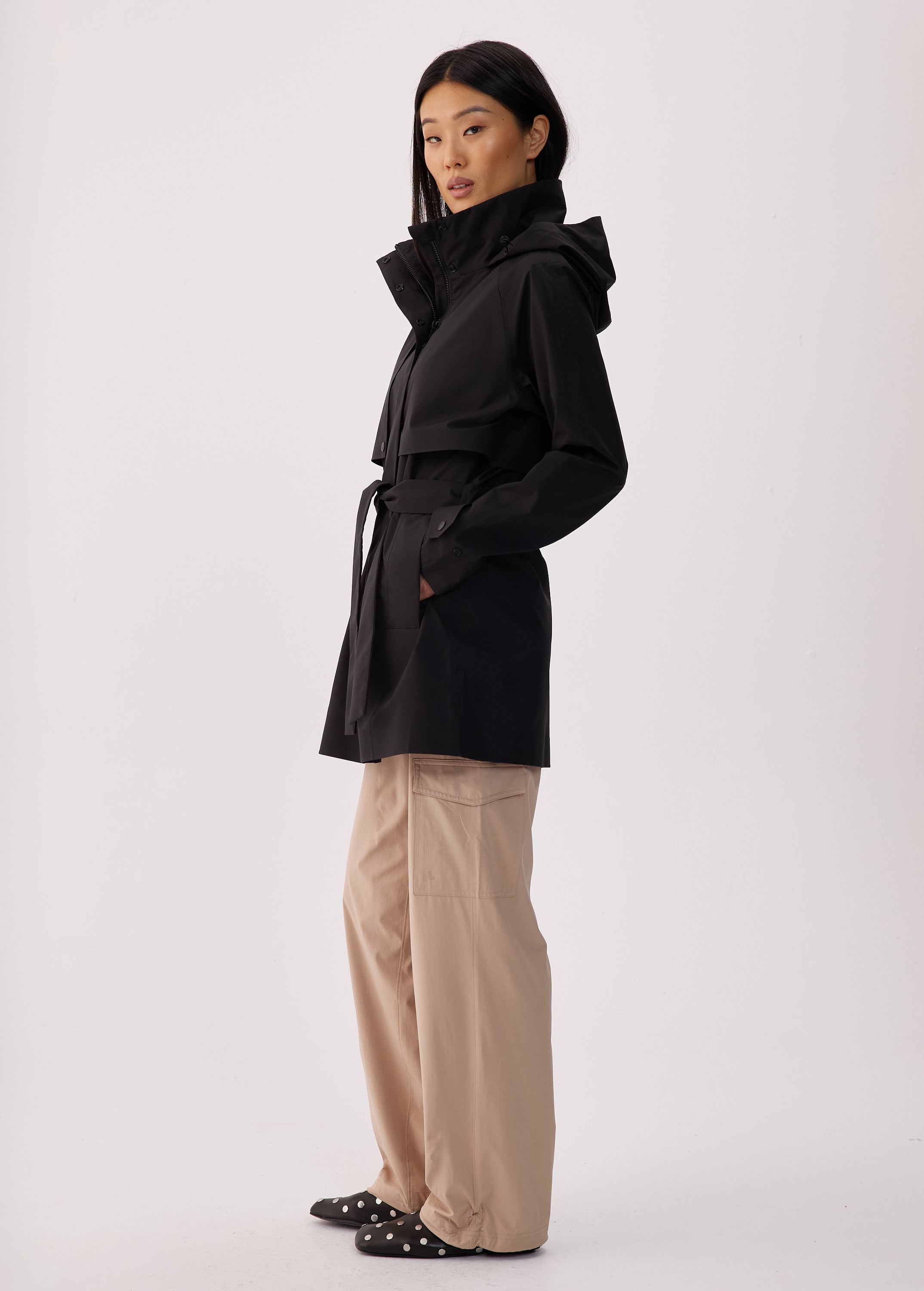 Lolë Alizé Short Trench Coat in black — fit note: Cut with a relaxed fit for comfortable layering