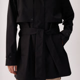 Lolë Alizé Short Trench Coat in black — fit note: Cut with a relaxed fit for comfortable layering