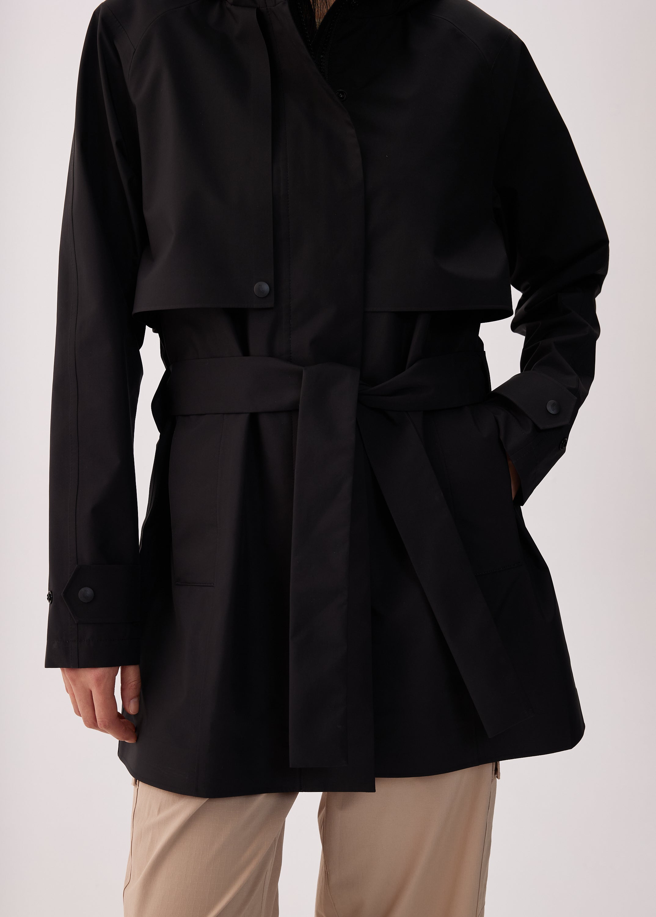 Lolë Alizé Short Trench Coat in black — fit note: Cut with a relaxed fit for comfortable layering