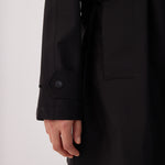 Lolë Alizé Short Trench Coat in black — fit note: Cut with a relaxed fit for comfortable layering