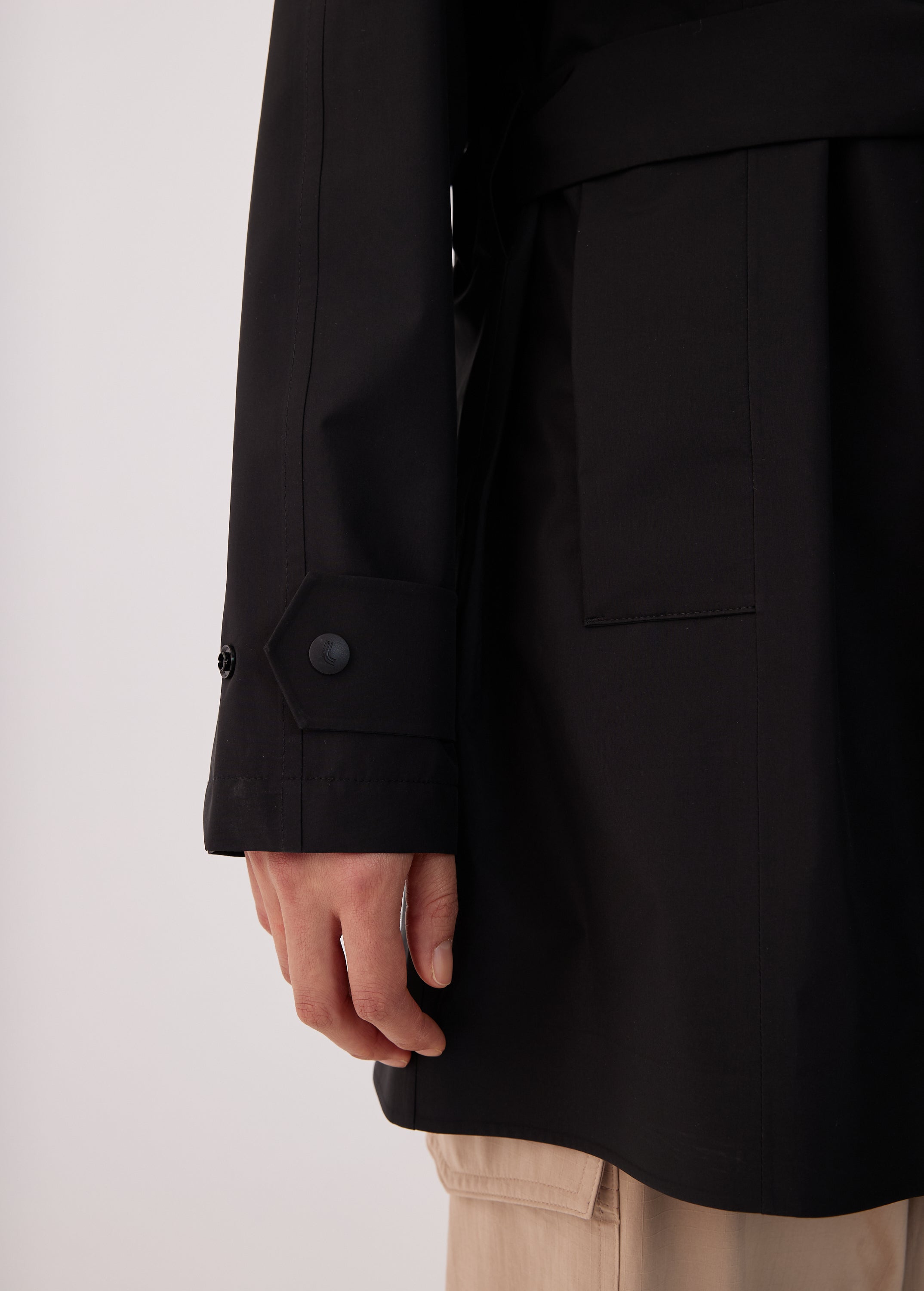 Lolë Alizé Short Trench Coat in black — fit note: Cut with a relaxed fit for comfortable layering